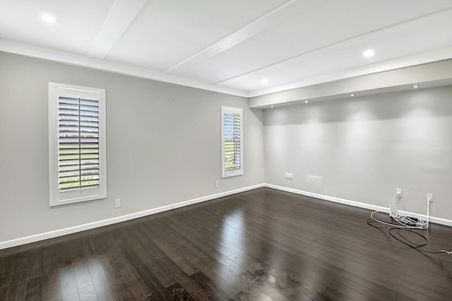 spare room featuring baseboards, wood finished floors, and recessed lighting