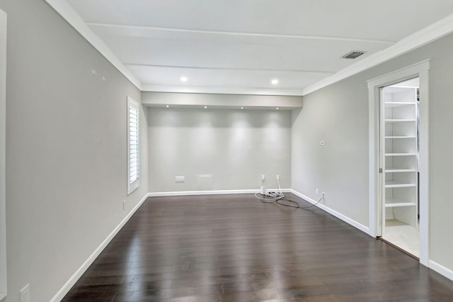 empty room featuring recessed lighting, visible vents, baseboards, and wood finished floors