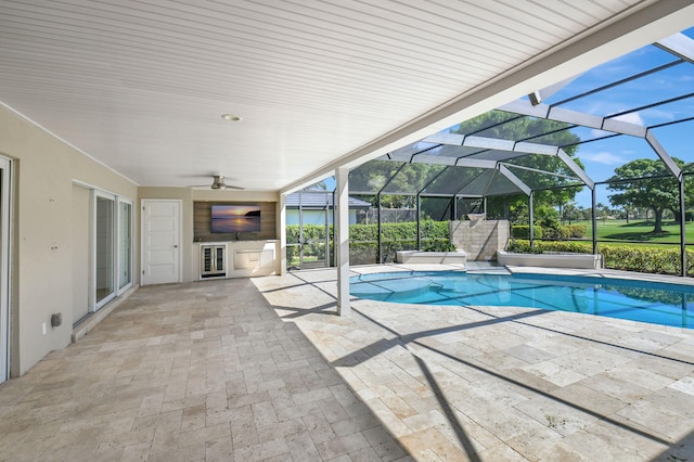 pool featuring ceiling fan, a patio area, and a lanai