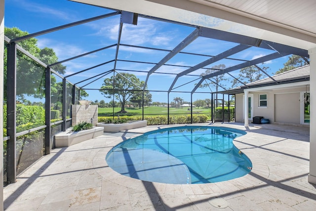 pool with a patio and glass enclosure