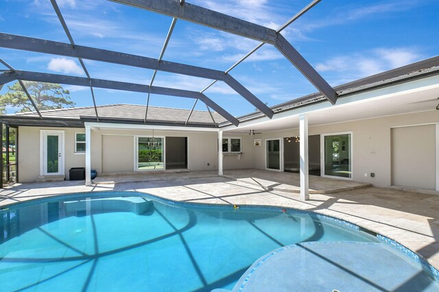 outdoor pool with a lanai and a patio area