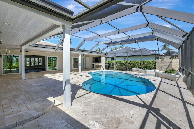 view of pool with a lanai, a fenced in pool, and a patio