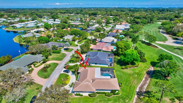 bird's eye view with a water view and a residential view