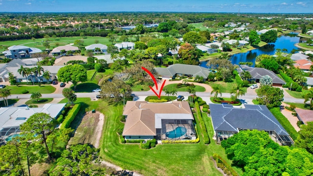 drone / aerial view featuring a water view and a residential view