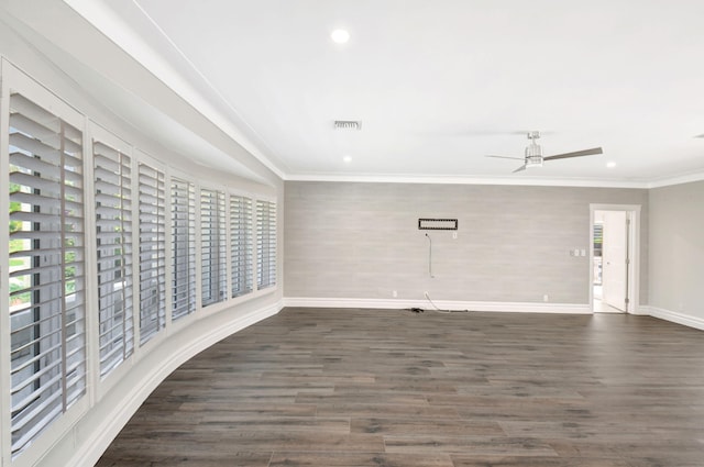 empty room featuring recessed lighting, visible vents, baseboards, dark wood finished floors, and crown molding