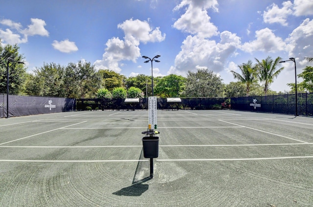 view of sport court with fence