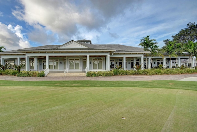 exterior space with a front yard and covered porch