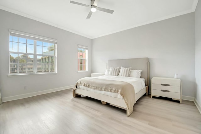 bedroom with light wood-style flooring, baseboards, ceiling fan, and ornamental molding