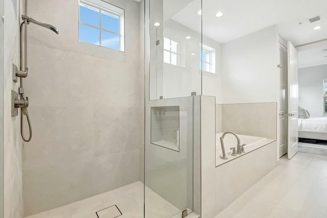 bathroom with ensuite bathroom, a marble finish shower, and a bath