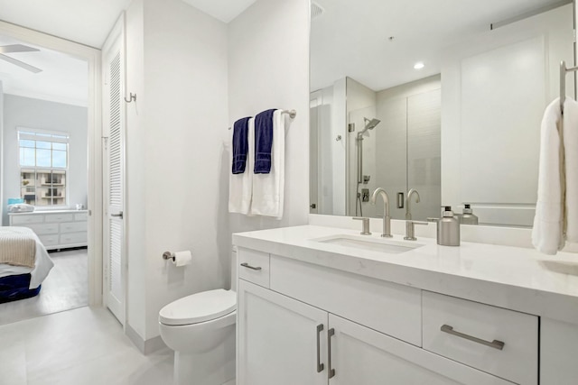 full bathroom featuring a shower stall, toilet, and vanity