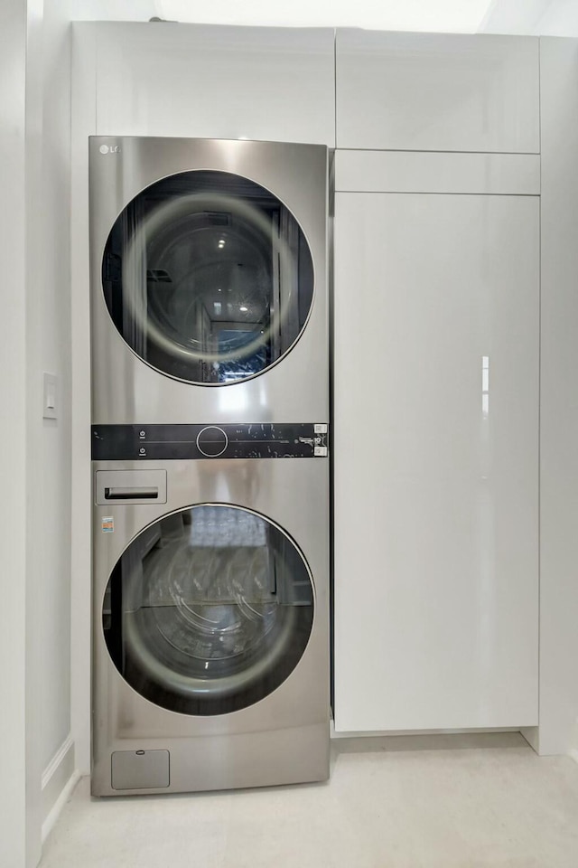 laundry area with laundry area and stacked washing maching and dryer