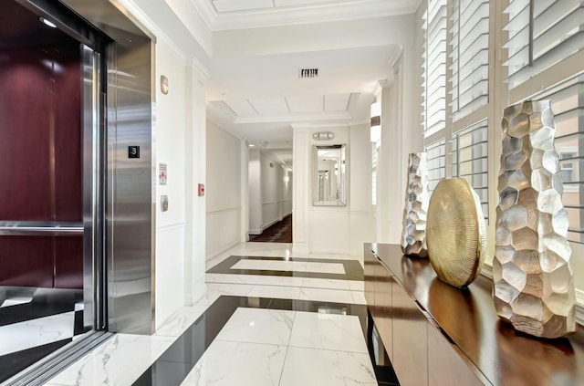 hall with elevator, visible vents, marble finish floor, and crown molding