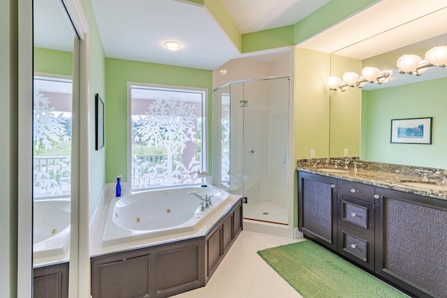 full bath featuring double vanity, a tub with jets, a sink, and a shower stall