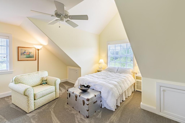 bedroom with vaulted ceiling, carpet floors, radiator heating unit, and baseboards