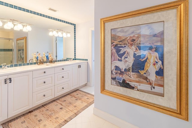 full bathroom with double vanity, visible vents, tile patterned flooring, an enclosed shower, and a sink