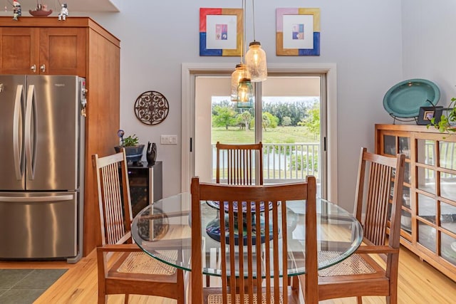 dining space with light wood-style flooring