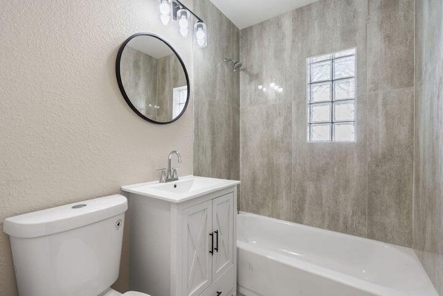 full bathroom featuring shower / bath combination, a textured wall, vanity, and toilet