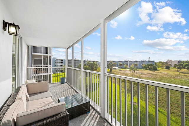 sunroom / solarium featuring a view of city