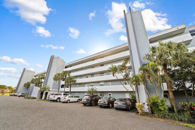 view of property featuring uncovered parking