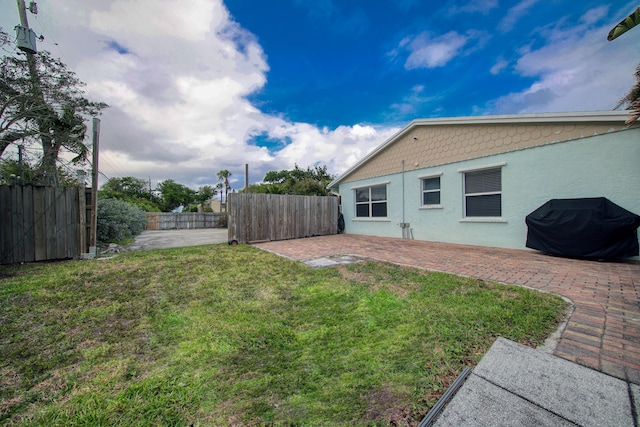 view of yard featuring a patio area and fence