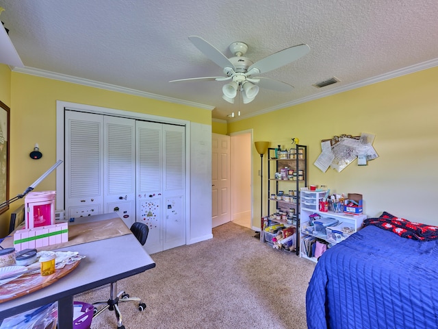 carpeted bedroom featuring a closet, visible vents, and crown molding