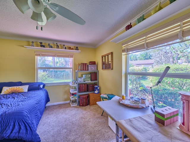 bedroom with carpet floors, ceiling fan, ornamental molding, and a textured ceiling