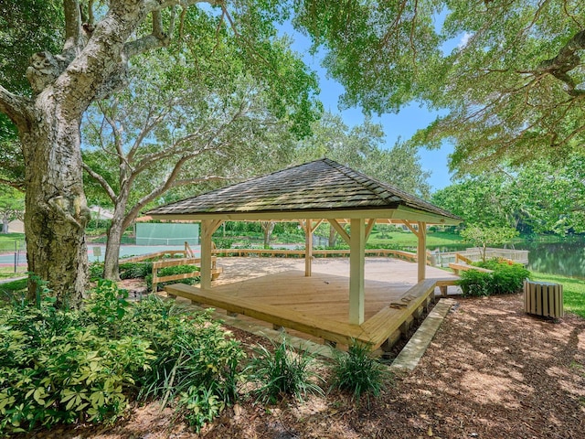 surrounding community featuring fence and a gazebo