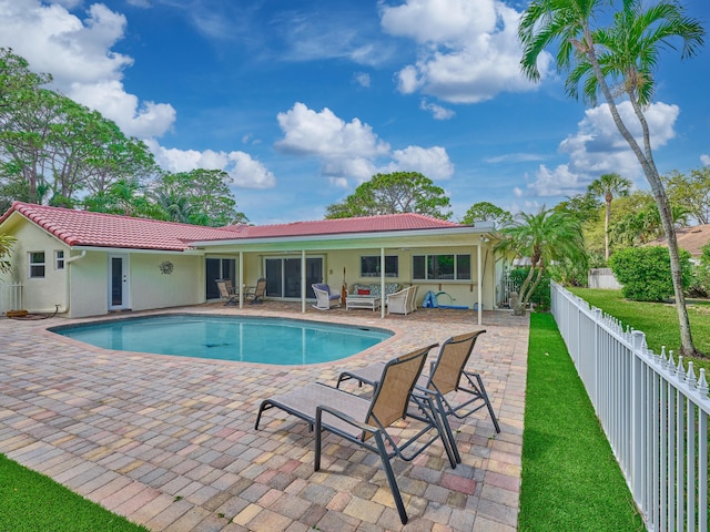 view of swimming pool with a patio area, a fenced backyard, and a fenced in pool