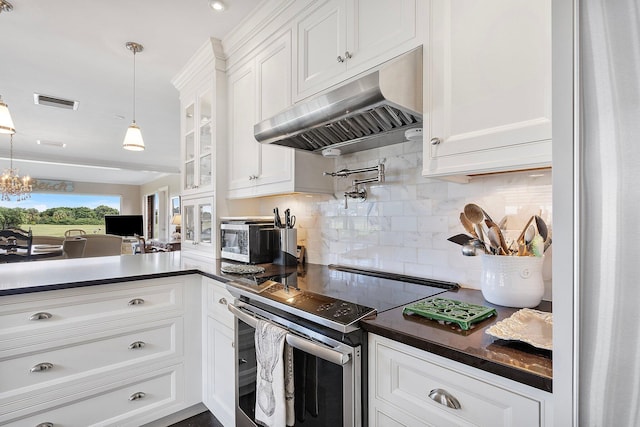 kitchen featuring electric stove, dark countertops, backsplash, white cabinets, and under cabinet range hood