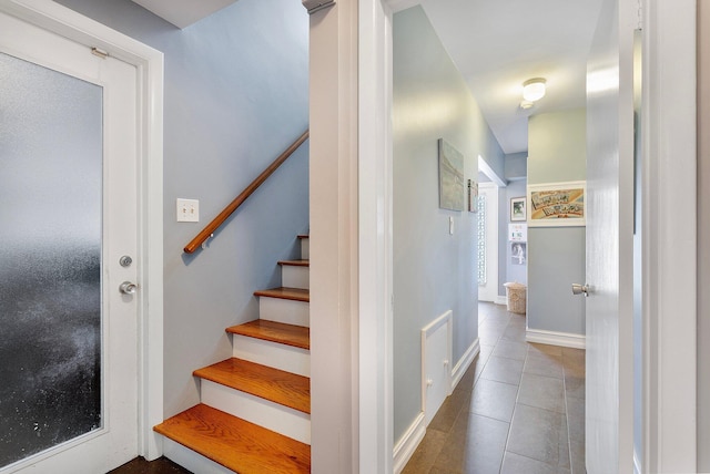 stairway with tile patterned flooring