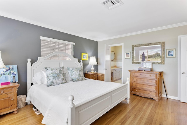 bedroom featuring baseboards, visible vents, ornamental molding, ensuite bathroom, and light wood-type flooring