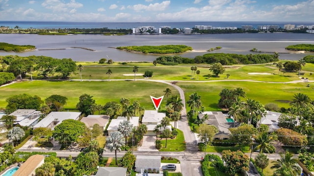 aerial view with view of golf course and a water view