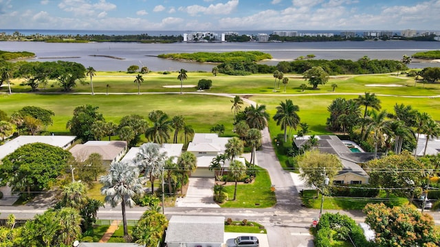 birds eye view of property featuring a water view and golf course view