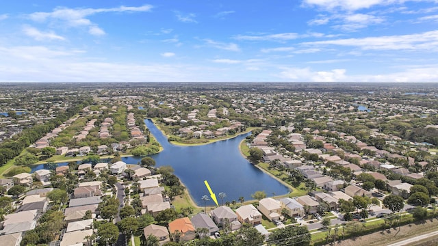 drone / aerial view with a water view and a residential view