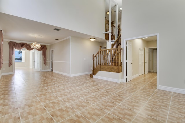 unfurnished living room featuring visible vents, an inviting chandelier, tile patterned flooring, baseboards, and stairs