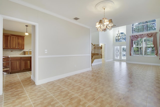 interior space with visible vents, baseboards, stairs, french doors, and an inviting chandelier