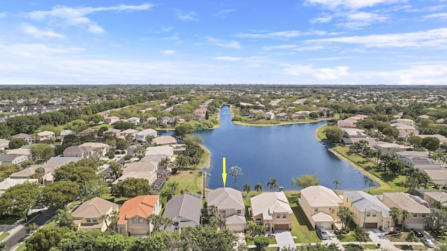 bird's eye view featuring a water view and a residential view