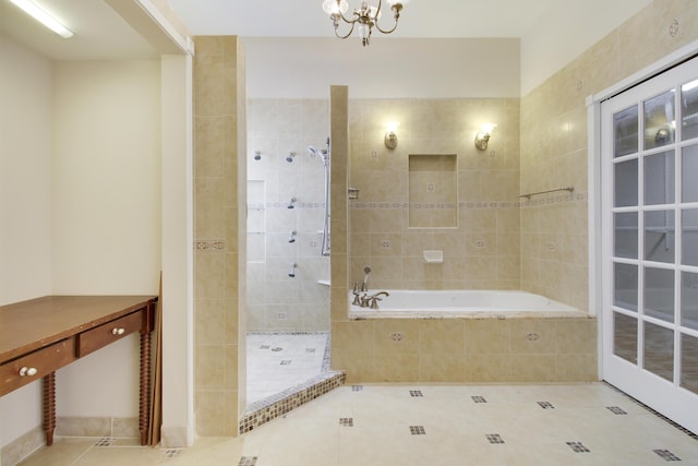 full bathroom with a bath, a chandelier, tiled shower, and tile patterned floors