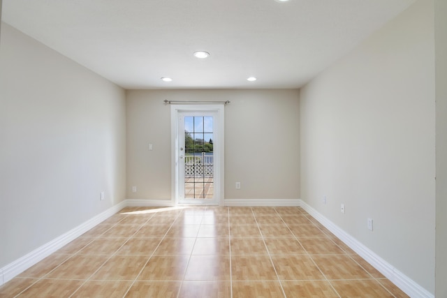 unfurnished room with light tile patterned floors, baseboards, and recessed lighting