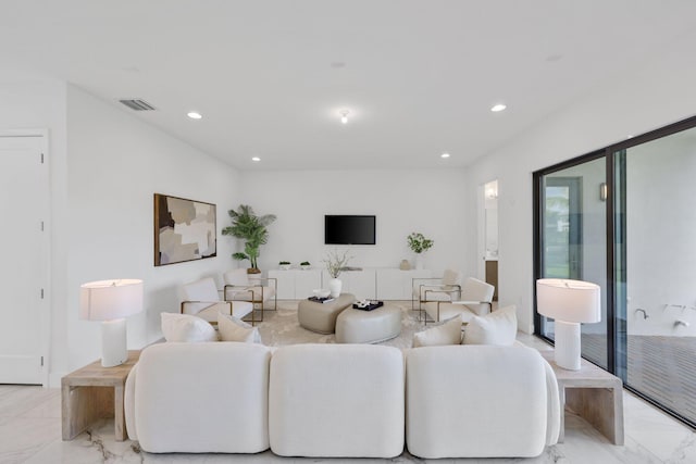 living room with marble finish floor, visible vents, and recessed lighting