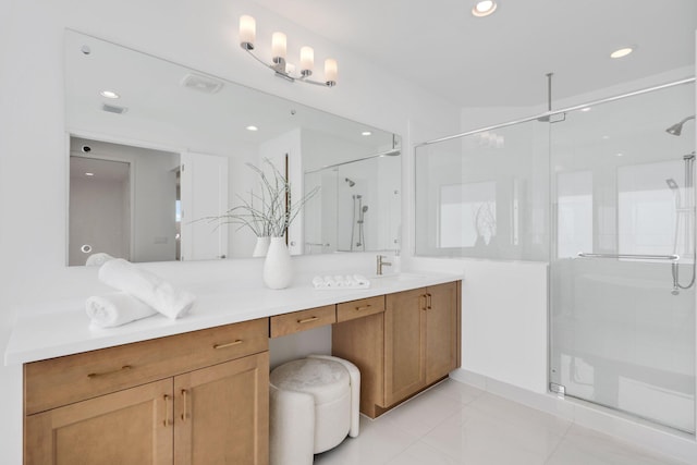 bathroom featuring a stall shower, visible vents, vanity, and recessed lighting