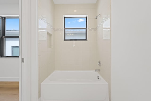 full bath with tub / shower combination and baseboards