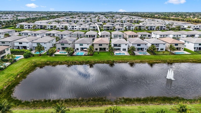 aerial view with a residential view and a water view