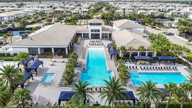 view of pool featuring a patio area and a residential view