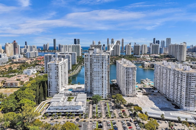 drone / aerial view featuring a water view and a city view