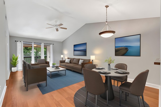 living area with lofted ceiling, a ceiling fan, baseboards, and wood finished floors