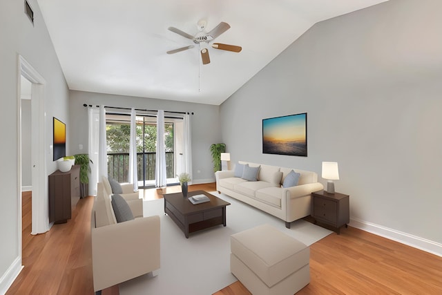 living area with light wood-style floors, a ceiling fan, baseboards, and high vaulted ceiling