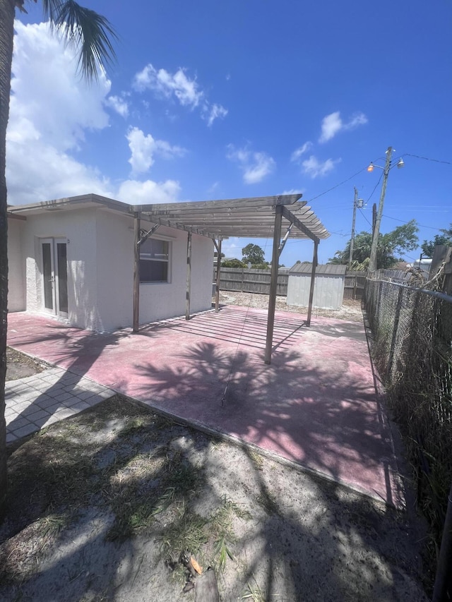 exterior space with a fenced backyard and a pergola