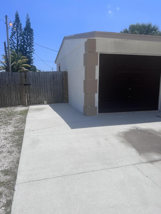 garage with fence