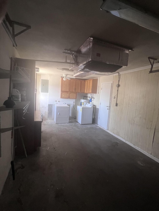 kitchen featuring concrete floors and washer and clothes dryer